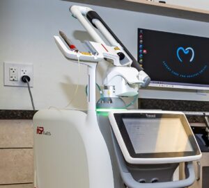 Dental laser machine with digital display screen.